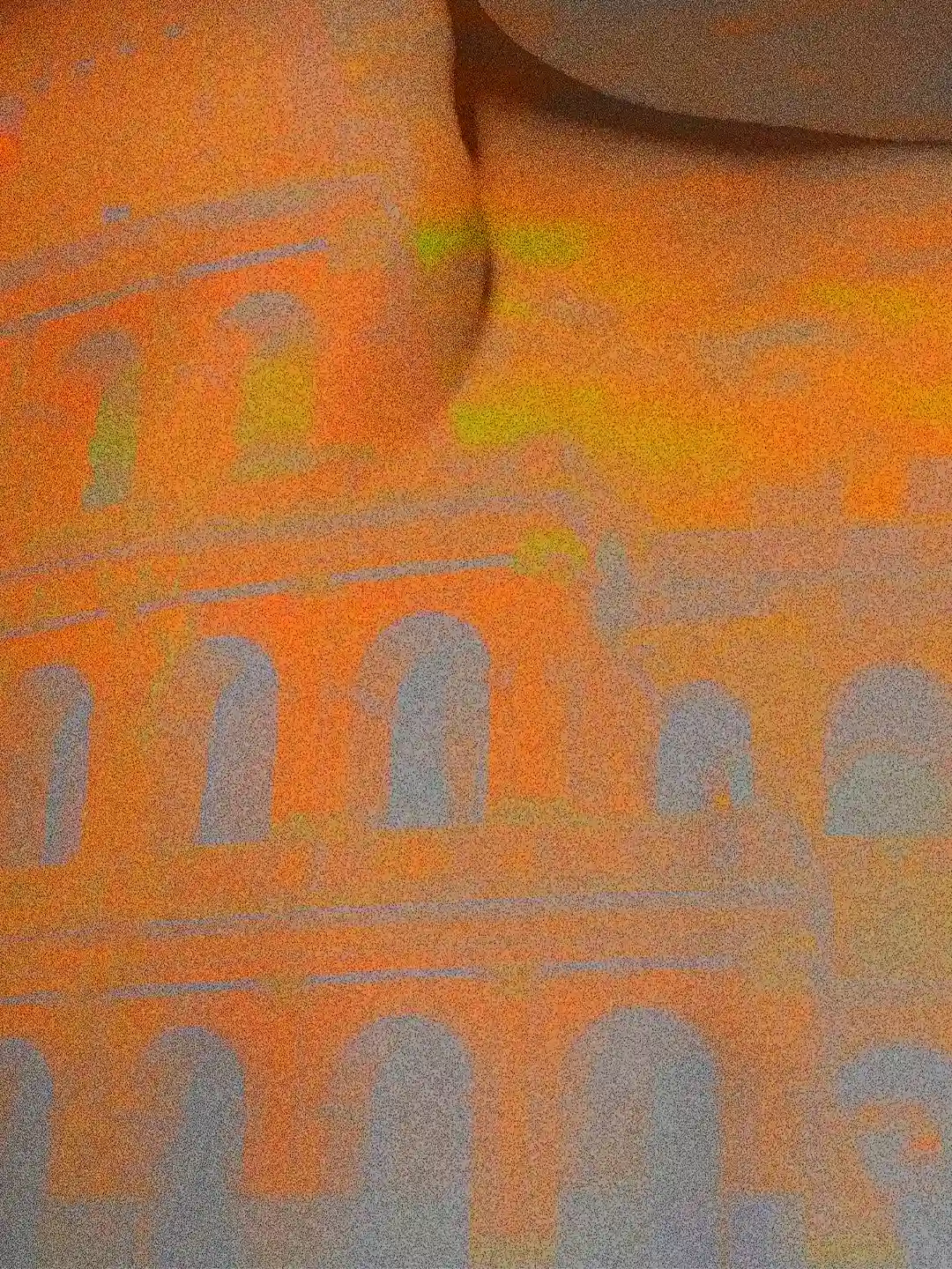 Detail of the artwork Vestigia: the architecture of the Colosseum is grafted onto the surface of a body, merging the texture of stone with human anatomy